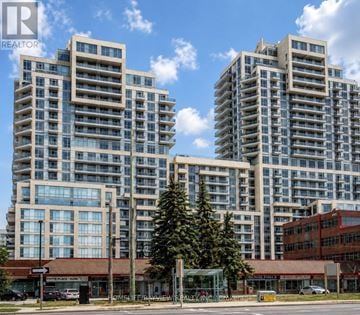 Richmond Hill (Langstaff) condo for rent - Two high-rise buildings with glass windows and balconies are situated next to a tree and a building with a red awning.