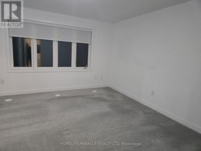 Barrie (Innis-Shore) townhouse for rent - A room with a window and a grey floor.