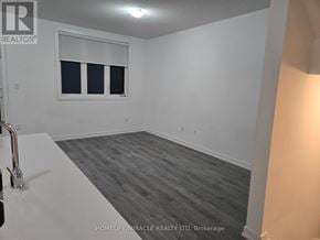 Barrie (Innis-Shore) townhouse for rent - A room with a window and a sink.