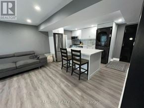 Brampton (Queen Street Corridor) apartment for rent - A modern kitchen with a dining table and chairs.