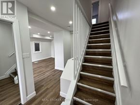 Hamilton (Crown Point) apartment for rent - A staircase with wooden steps and white railings.