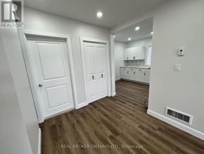 Hamilton (Crown Point) apartment for rent - A hallway with white doors and wooden floors.