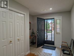 Hamilton (Gurnett) apartment for rent - A white door is on the left and a black door is on the right.