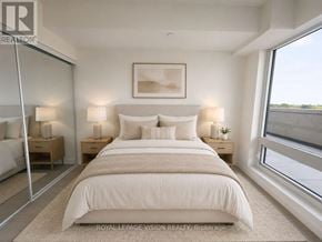 Toronto (Humber Heights) condo for rent - A bedroom with a large bed, two nightstands, and a framed picture on the wall.