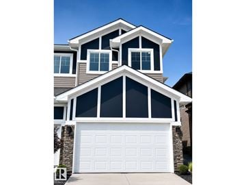 Edmonton apartment for rent - A modern house with a white garage door.