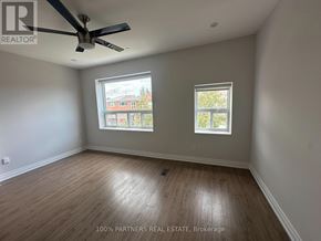 Toronto (Trinity-Bellwoods) apartment for rent - A room with a ceiling fan and two windows.