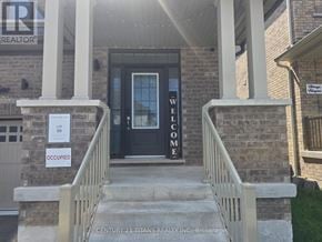 Oshawa (Eastdale) apartment for rent - The front of a building with a sign that says "Welcome" on the steps.