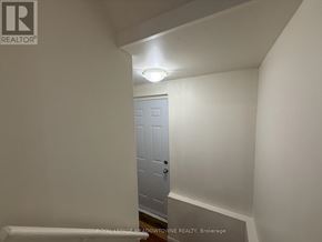 Brampton (Northwest Brampton) apartment for rent - A white door in a room with a light on.