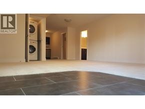 Coquitlam apartment for rent - A room with a washing machine and a dryer in it.