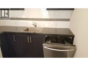 Coquitlam apartment for rent - A kitchen with a sink and a dishwasher.