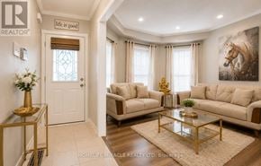 Brampton (Fletcher's Meadow) townhouse for rent - A living room with a glass coffee table and two couches.