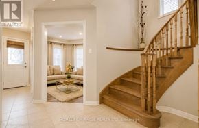 Brampton (Fletcher's Meadow) townhouse for rent - A spacious hallway with a staircase leading to the second floor.