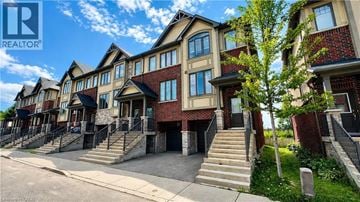 Ancaster townhouse for rent - A row of townhouses with a clear blue sky above them.