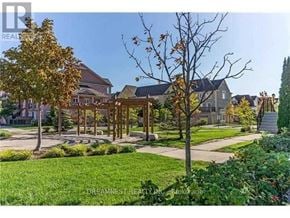 Mississauga (Churchill Meadows) townhouse for rent - A residential area with houses and trees.