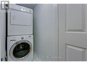 Mississauga (Churchill Meadows) townhouse for rent - A white dryer is in a small laundry room.