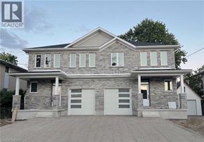 Kitchener apartment for rent - A two-story house with a garage is for sale.