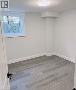 Kitchener apartment for rent - A room with a window and a grey floor.