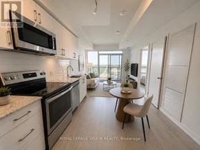 Toronto (Humber Heights) condo for rent - A modern kitchen with a dining table and chairs.