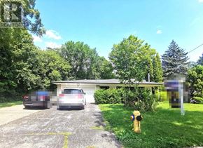 Toronto (Bayview Village) apartment for rent - A parking lot with a fire hydrant and a building in the background.