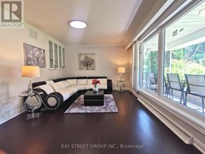 Toronto (Bayview Village) apartment for rent - A well-lit living room with a large window and a view of the outdoors.