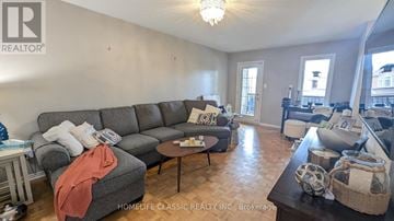 Vaughan (Vellore Village) apartment for rent - A living room with a grey sofa and a coffee table.