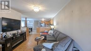 Vaughan (Vellore Village) apartment for rent - A living room with a grey couch and a flat screen TV.