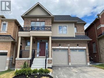 East Gwillimbury (Holland Landing) apartment for rent - A two-story house with a red door and garage doors.