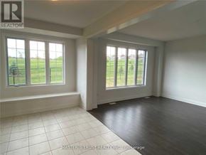 East Gwillimbury (Holland Landing) apartment for rent - A room with a large window and a wooden floor.