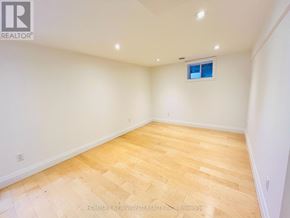 Toronto (Willowdale East) apartment for rent - A room with wooden flooring and a small window.