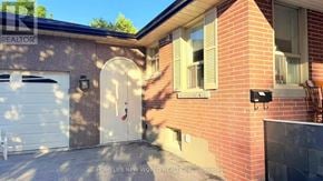 Richmond Hill (Crosby) apartment for rent - A brick house with a white door and a sign that says REALTOR.