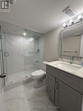 Halton Hills (Georgetown) apartment for rent - A bathroom with a toilet, sink, and shower.
