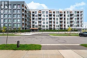 Milton (Fo Ford) condo for rent - Apartment complex with a tree and a car parked in front.