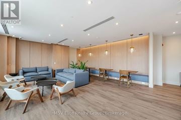 Milton (Fo Ford) condo for rent - A modern living room with a dining table and chairs.
