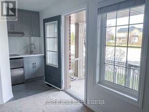 Brampton (Heart Lake East) townhouse for rent - A kitchen with a sink and a door leading to a balcony.