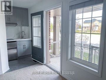 Brampton (Heart Lake East) townhouse for rent - A kitchen with a sink and a door leading to a balcony.