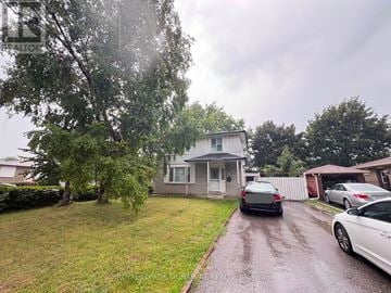 Brampton (Madoc) apartment for rent - A house with a white car parked in front.