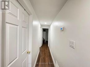 Brampton (Madoc) apartment for rent - A long hallway with white walls and wooden floors.