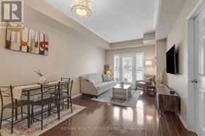 Mississauga (Churchill Meadows) condo for rent - A well-lit living room with a dining table and chairs.