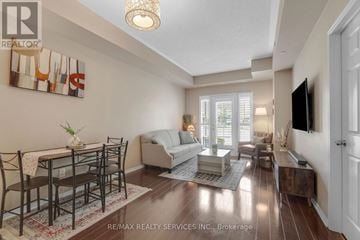 Mississauga (Churchill Meadows) condo for rent - A well-lit living room with a dining table and chairs.