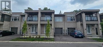 Niagara Falls (Hospital) house for rent - A row of townhouses with a car parked in front of the first one.