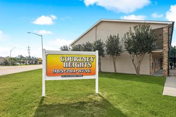 Slidell apartment for rent - A sign for Country Heights with a phone number on it.