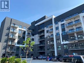 Oakville (Go Glenorchy) condo for rent - A modern apartment building with multiple balconies and a parking lot in front.