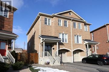Mississauga (Applewood) apartment for rent - A two-story brick house with a car parked in front.