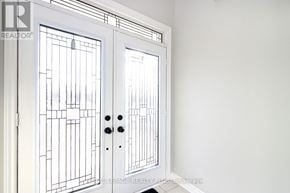 Mississauga (Applewood) apartment for rent - A white door with a glass panel and a handle.
