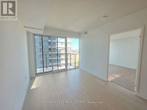 Toronto (Humber Heights) condo for rent - A spacious room with a sliding glass door leading to a balcony.