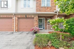 London North (North A) townhouse for rent - A house with a garage door numbered 303.