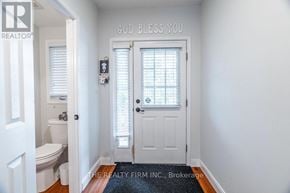 London North (North A) townhouse for rent - A bathroom with a toilet, sink, and a door with a sign that says "God Bless You".