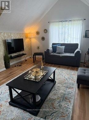 Richmond Hill (Mill Pond) apartment for rent - A living room with a black coffee table and a grey couch.