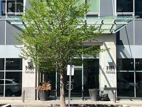 Markham (Thornhill) condo for rent - A tree in front of a building with the sign 7171 Yonge.