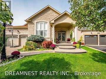 Milton (Be Beaty) apartment for rent - A house with the text "DREAMNEST REALTY INC., Brokerage" in front of it.